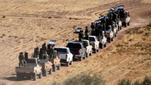 Turkey-backed FSA fighters are heading toward Syrian town of Tal Abyad from Turkish border town of Akcakale, Turkey, Thursday, Oct. 10, 2019. Turkish President Recep Tayyip Erdogan says that there have been 109 "terrorists killed" — a reference to Syrian Kurdish fighters — since Ankara launched an offensive into Syria the previous day.  (DHA via AP)