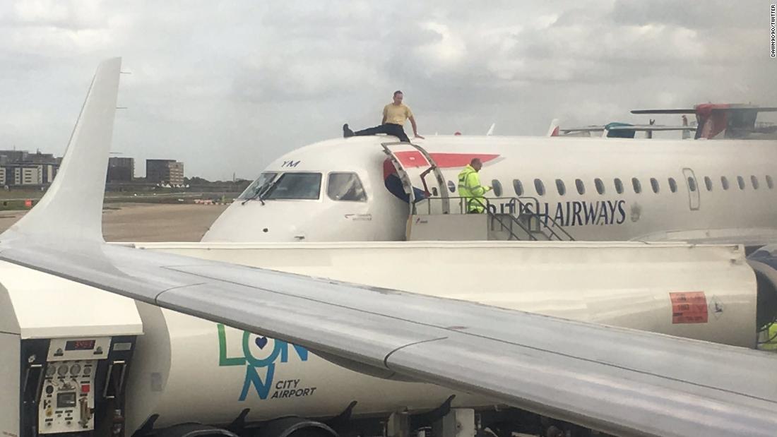 Extinction Rebellion Activist Climbs On Top Of Plane During Protests At 
