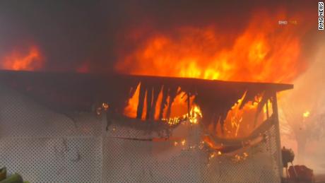 The fire has burned multiple buildings in the Villa Calimesa Mobile Home Park.