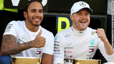 Teammates Lewis Hamilton and Bottas celebrate after the Russian Grand Prix. 