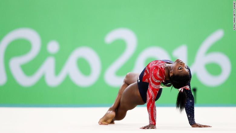 Biles competes on the floor at the 2016 Olympics.