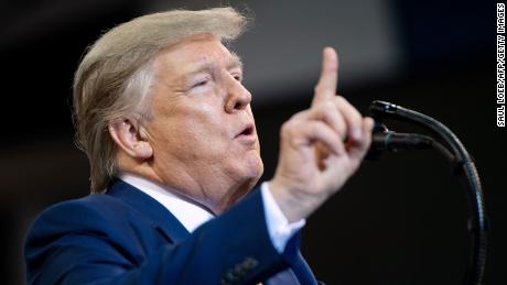 US President Donald Trump gestures as he speaks during a &quot;Keep America Great&quot; rally at Sudduth Coliseum at the Lake Charles Civic Center in Lake Charles, Louisiana, on October 11, 2019.