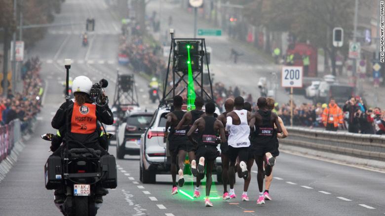 Kipchoge was assisted by an army of 30 pacemakers. A pace car emitted a green laser to help keep time.