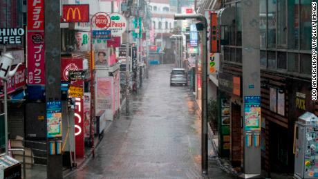 Takeshita street, one of the most crowded and well-known shopping areas in the city, is pictured completely deserted in the Harajuku district of Tokyo.