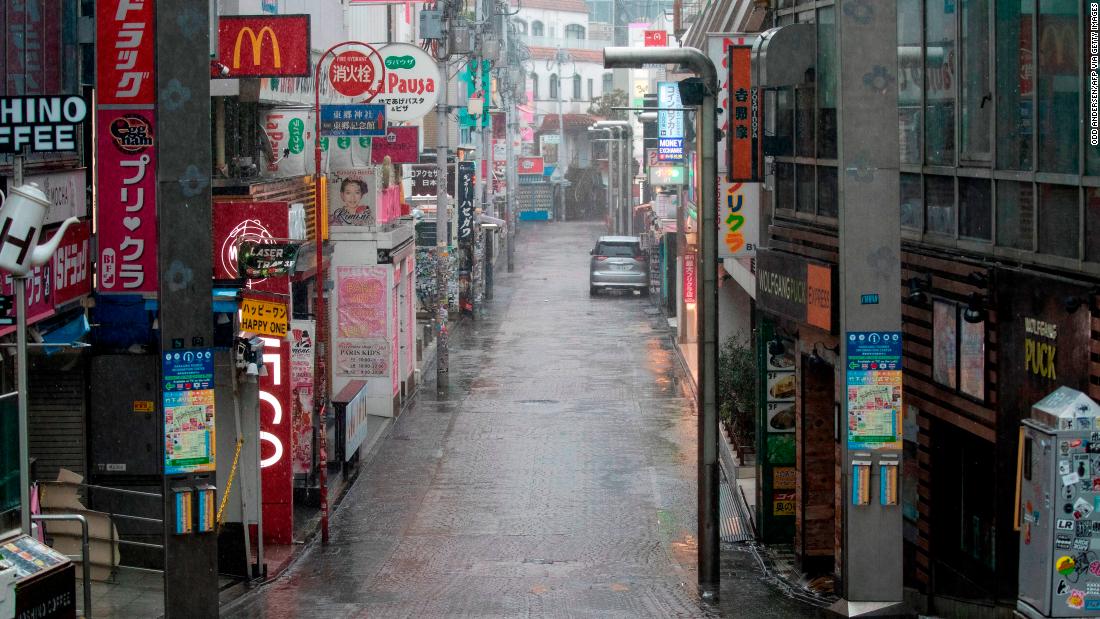 Takeshita street, one of the most crowded and well-known shopping areas in the city, is pictured completely deserted in the Harajuku district of Tokyo.