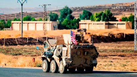 A US military vehicle patrols a road near the town of Tal Baydar in the countryside of Syria&#39;s northeastern Hasakeh province on October 12, 2019. - Kurdish forces in northeast Syria Saturday battled a Turkish push along the country&#39;s northern border as Ankara&#39;s offensive went into its fourth day, following a night of steady advances. Turkey is targeting the Kurdish-led Syrian Democratic Forces (SDF), a key US ally in the five-year battle to crush the Islamic State group. The SDF lost 11,000 fighters in the US-led campaign. (Photo by Delil SOULEIMAN / AFP) (Photo by DELIL SOULEIMAN/AFP via Getty Images)