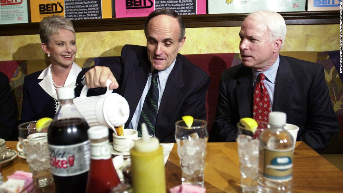 Giuliani pours coffee as he has breakfast with US Sen. John McCain and McCain&#39;s wife, Cindy, in April 2000. McCain came to New York to campaign for Giuliani, who was running for a US Senate seat. Giuliani dropped out of the race after announcing that he had prostate cancer and wanted to focus on treatment.