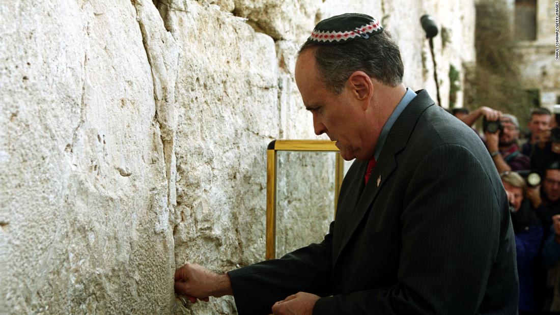 Giuliani touches the Western Wall, Judaism&#39;s holiest site, in December 2001. He was visiting as part of a delegation that included Pataki and Mayor-elect Michael Bloomberg.