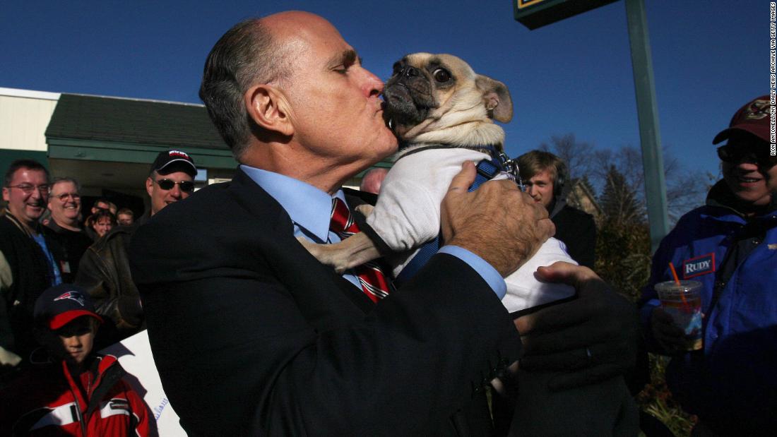 Giuliani kisses Thompson the pug while campaigning in New Hampshire in November 2007. The dog was wearing a shirt that said, &quot;Anybody but Hillary for president.&quot;