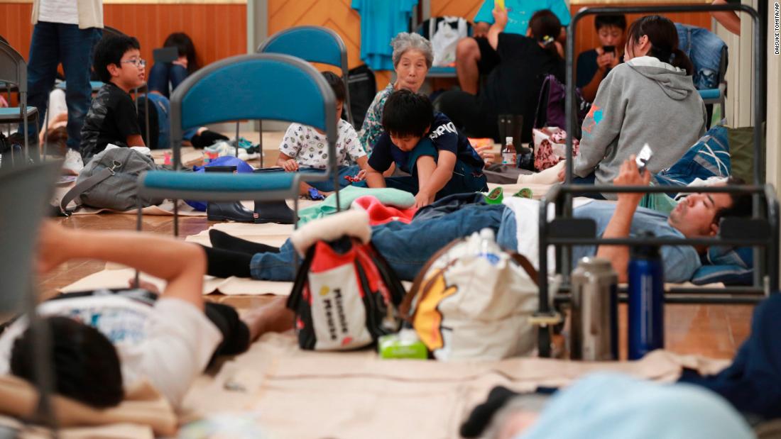 Evacuees gather in a junior high school gymnasium in Shizuoka, Japan, on October 12.