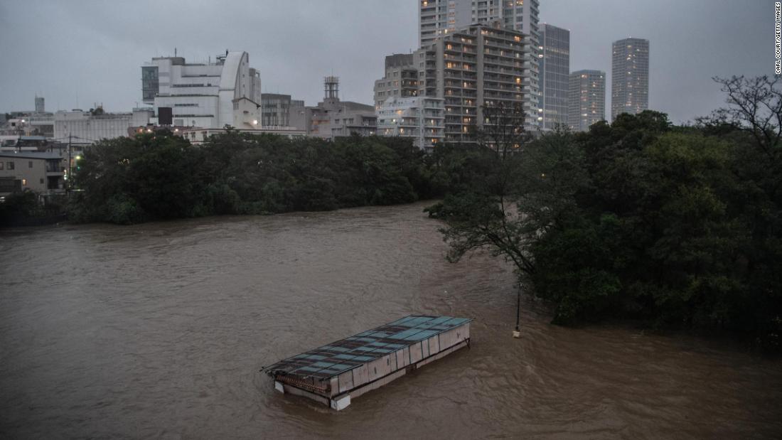 A café is submerged in floodwater from the Tama River in Tokyo on October 12.