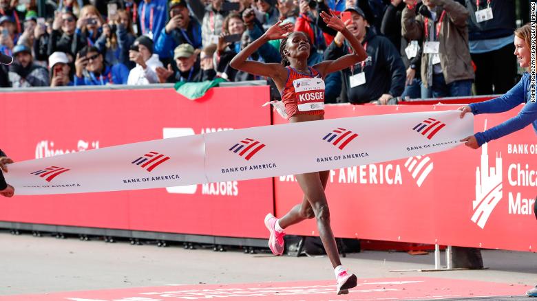 Brigid Kosgei crosses the finish line at the Chicago Marathon with a world record time.