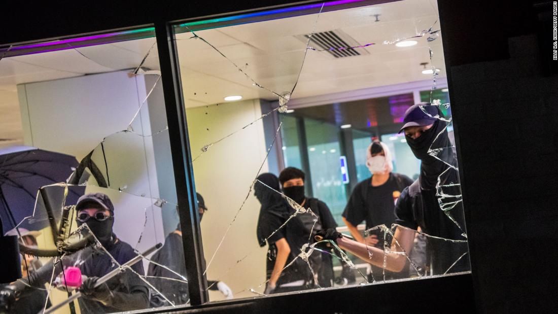 Protesters vandalize a shopping mall restaurant on October 13.