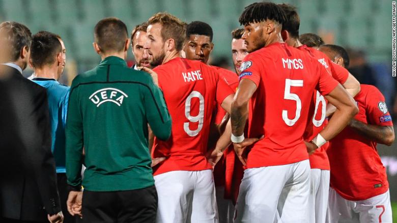 England&#39;s forward Harry Kane speaks with the referees during a temporary interruption of the Euro 2020 match between Bulgaria and England.