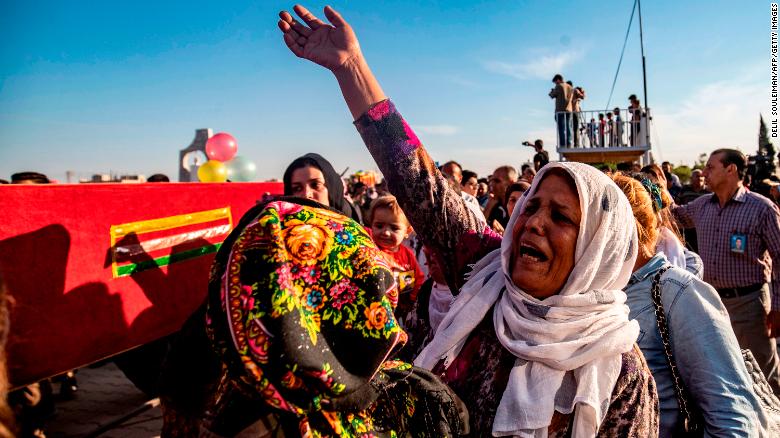 People in Qamishli, Syria, attend a funeral Monday, October 14, for five fighters of the Syrian Democratic Forces.