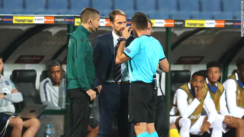 Gareth Southgate speaks with referee Vasil Levski during the UEFA Euro 2020 qualifier.