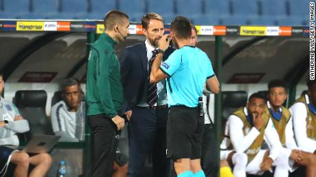 Gareth Southgate speaks with referee Vasil Levski during the UEFA Euro 2020 qualifier.