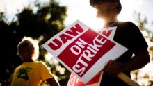 FILE - In this Sept. 16, 2019 file photo, union members picket outside a General Motors facility in Langhorne, Pa. General Motors CEO Mary Barra joined negotiators at the bargaining table Tuesday, Oct. 15, an indication that a deal may be near to end a monthlong strike by members of the United Auto Workers union that has paralyzed the company's factories. (AP Photo/Matt Rourke, File)