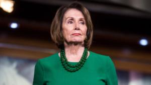 House Speaker Nancy Pelosi listens during a news conference on Tuesday, October 15 in Washington.