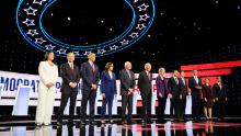 Presidential candidates Tulsi Gabbard, Tom Steyer, Cory Booker, Kamala Harris, Bernie Sanders, Joe Biden, Elizabeth Warren, Pete Buttigieg, Andrew Yang, Beto O'Rourke, Amy Klobuchar and Julián Castro participate in the Democratic debate co-hosted by CNN and The New York Times in Westerville, Ohio, on Tuesday, October 15.