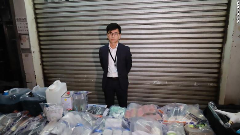 Hong Kong Police Superintendent Raymond Chou shows objects seized in a raid on October 15, 2019. 