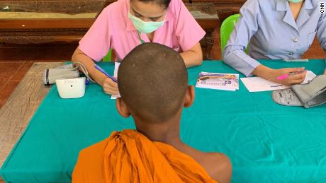 A young monk gets his health checked.