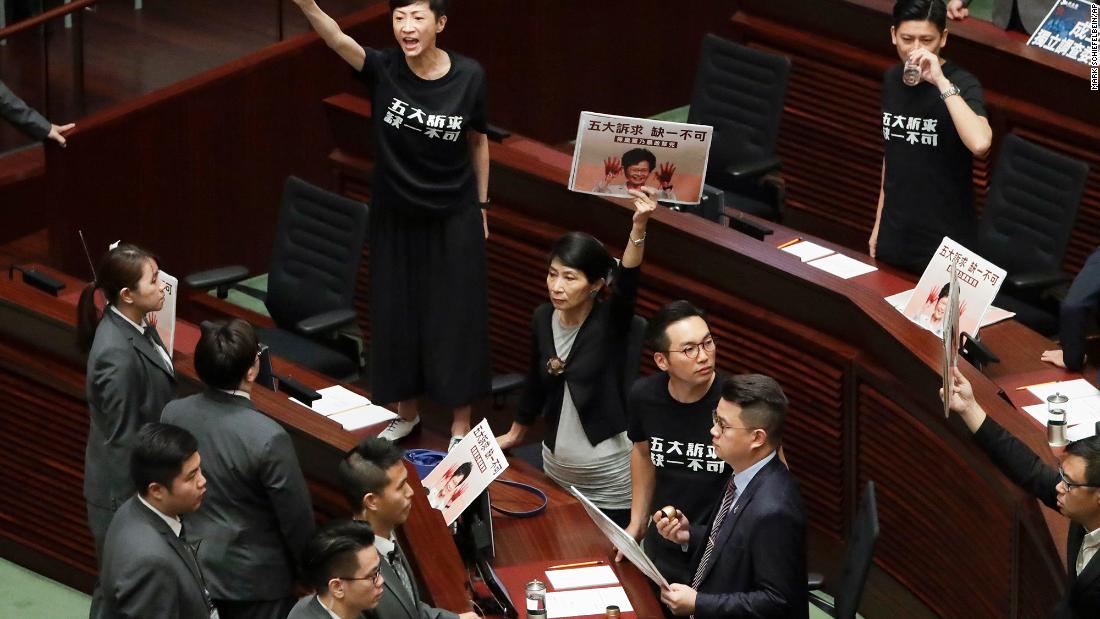 Pro-democracy lawmakers protest as Hong Kong Chief Executive Carrie Lam delivers a speech at the Legislative Council on Wednesday, October 16. Lam's annual policy address &lt;a href=&quot;https://www.cnn.com/2019/10/16/asia/hong-kong-protests-explosives-intl-hnk/index.html&quot; target=&quot;_blank&quot;&gt;ended in chaos&lt;/a&gt; as pro-democracy lawmakers repeatedly disrupted her speech and heckled her with calls to honor the demands of anti-government protesters.