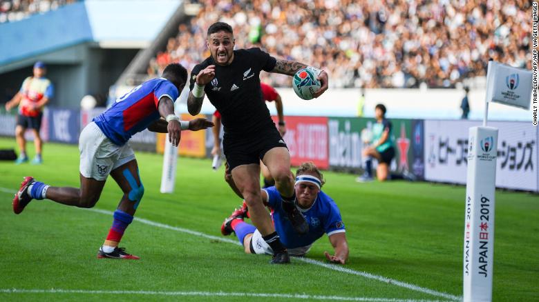 New Zealand&#39;s scrum-half TJ Perenara runs in to score a try against Namibia. 