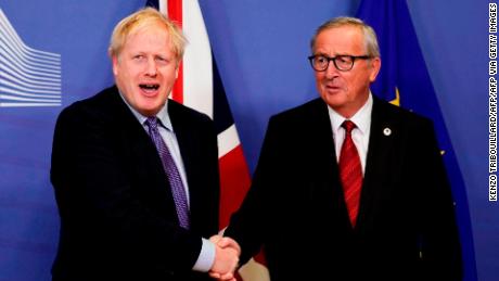 British Prime Minister Boris Johnson (L) shakes hands with President of the European Commission Jean-Claude Juncker as they prepare to address a press conference at a European Union Summit at European Union Headquarters in Brussels on October 17, 2019. (Photo by Kenzo TRIBOUILLARD / AFP) (Photo by KENZO TRIBOUILLARD/AFP via Getty Images)