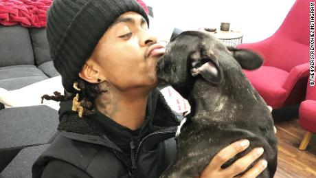 Running back Jet McKinnon smooches his favorite pooch Zoë.