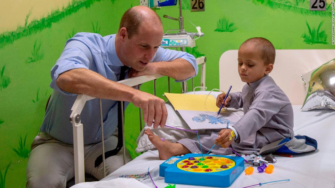 Prince William plays with 5-year-old Muhammed Sameer, a patient at Shaukat Khanum Memorial Cancer Hospital in Lahore on Thursday.