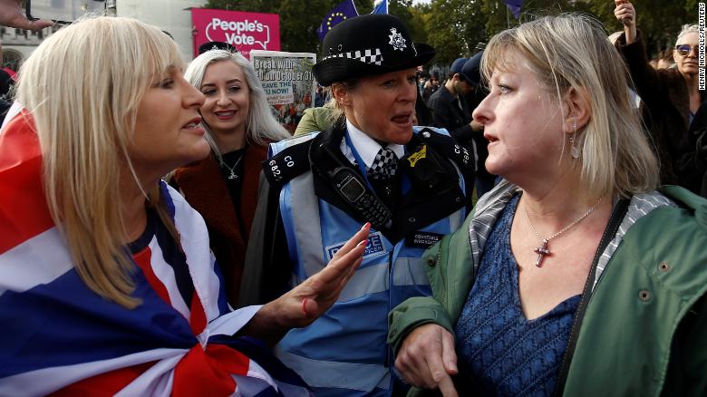 Pro-Brexit and anti-Brexit demonstrators argue at Parliament Square as lawmakers in the House of Commons debate nearby. 