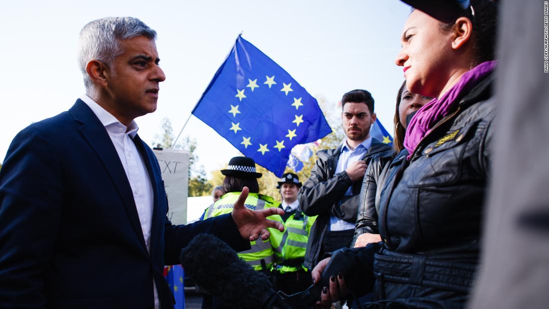 Mayor of London Sadiq Khan, who supports a second referendum, gives a media interview as demonstrators gather on Park Lane.