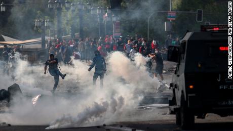 Demonstrators chash with soldiers in Santiago on Saturday.