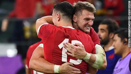 Wales fly-half Dan Biggar hugs Owen Watkin at full-time. 