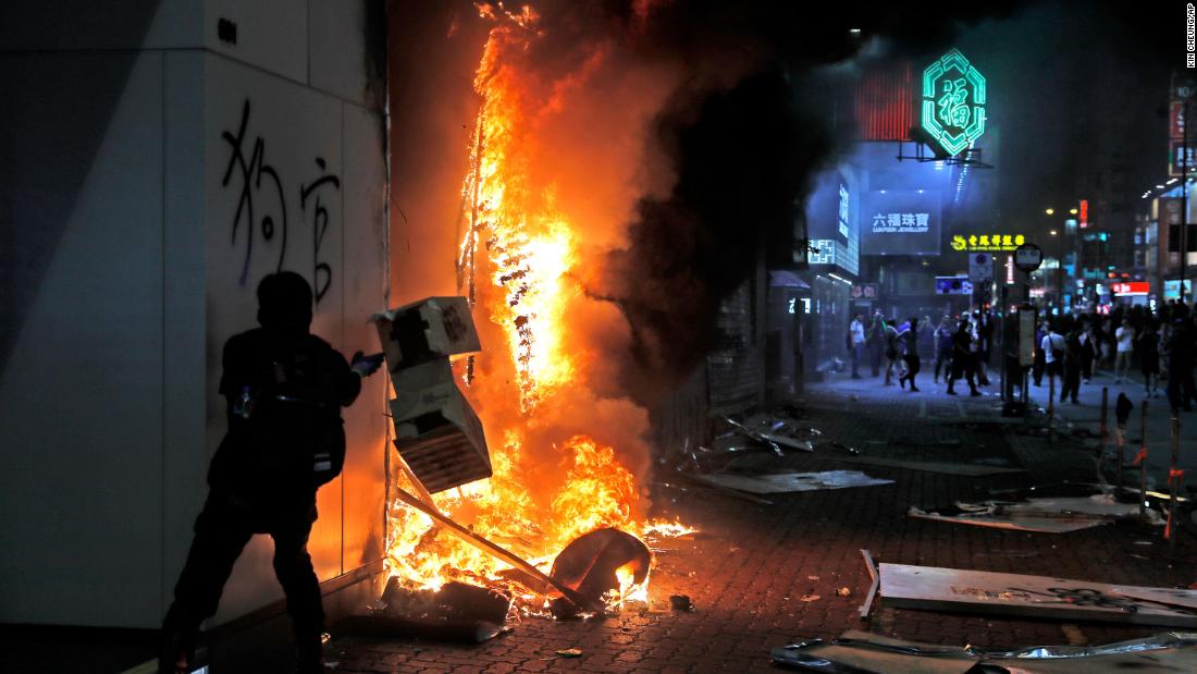 Protesters set fire to a shop on October 20.