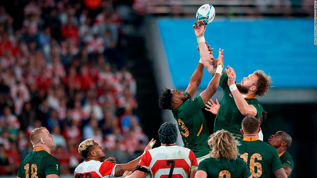 Lukhanyo Am (C) of South Africa jump for the balls during a lineout.
