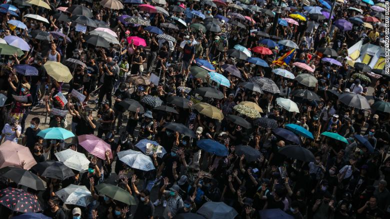 Protesters attend a pro-democracy march in Hong Kong on October 20.