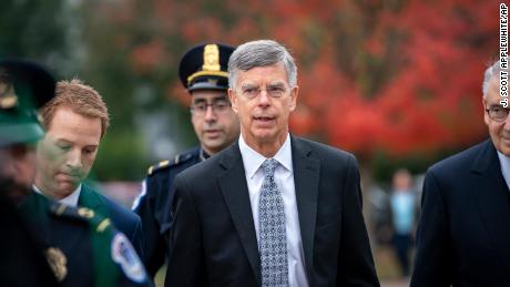 Bill Taylor, the top US diplomat in Ukraine is escorted by U.S. Capitol Police as he arrives to testify before House committees as part of the Democrats' impeachment investigation of President Donald Trump, at the Capitol in Washington, Tuesday, October 22.