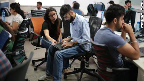 Employees work at Patym&#39;s headquarters. (Saurabh Das for CNN)