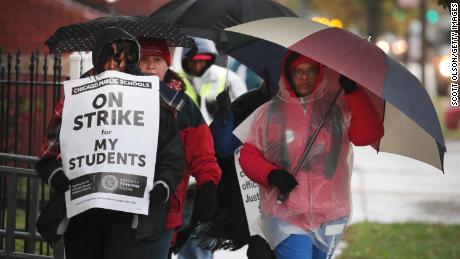 Teachers picketed in the rain outside Oscar DePriest Elementary School in Chicago.