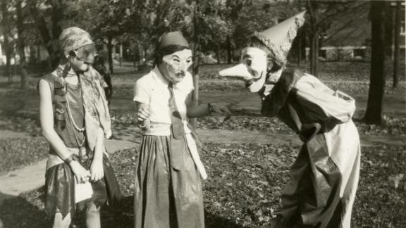 Halloween costumes from the first half of the 20th century were terrifying. Drawing on the holiday's pagan and Christian roots -- as a night to ward off evil spirits or reconcile with death, respectively -- people often opted for more morbid, serious costumes than the pop culture-inspired ones of today. Here, three girls prepare for Halloween festivities in the College Hill neighborhood of Cincinnati, Ohio, 1929.