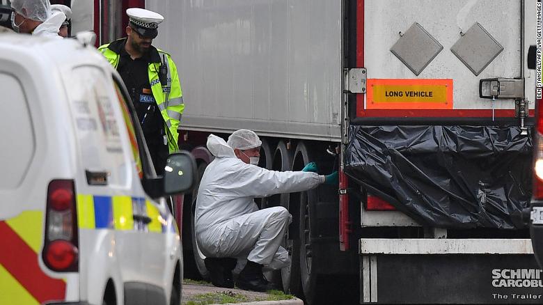 British Police forensics officers work on ther lorry found to be containing 39 dead bodies, at Waterglade Industrial Park in Grays, east of London, on October 23, 2019.
