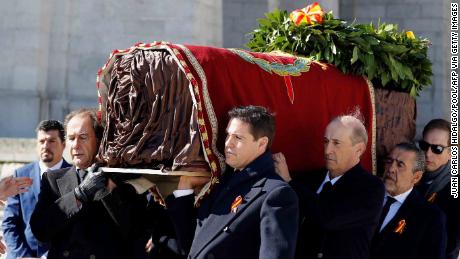 Family members Jose Cristobal (L) and Prince Louis Alphonse of Bourbon, Duke of Anjou (R), Francis Franco (3rdR) and Jaime Martinez-Bordiu (2ndR) carry the coffin of Spanish dictator Francisco Franco out of the basilica.