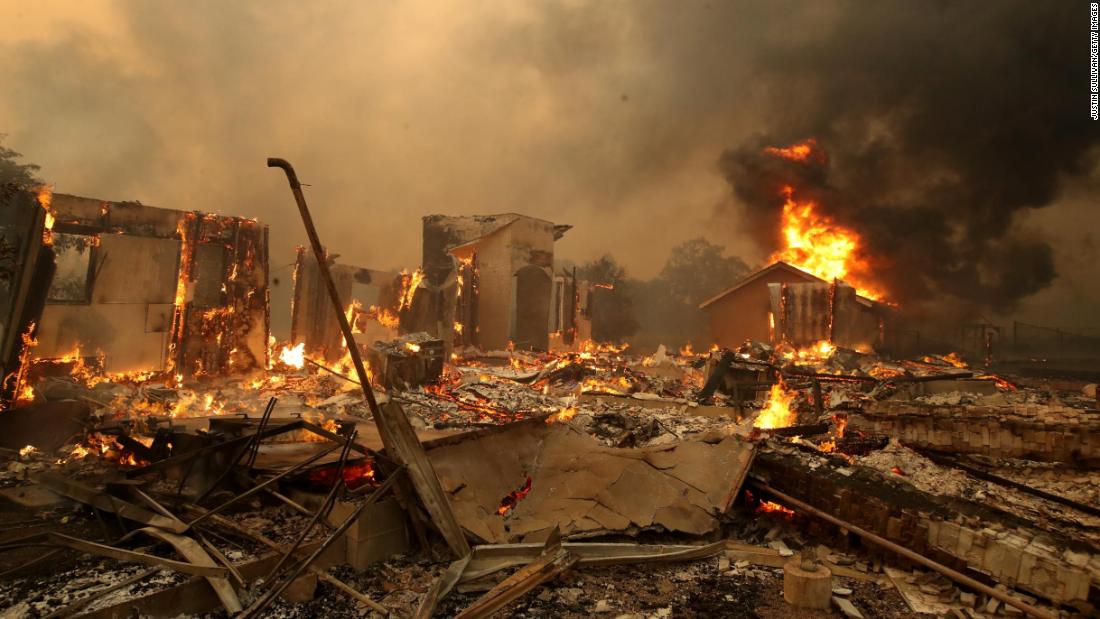 A structure continues to burn after the Kincade Fire moved through Geyserville on October 24.