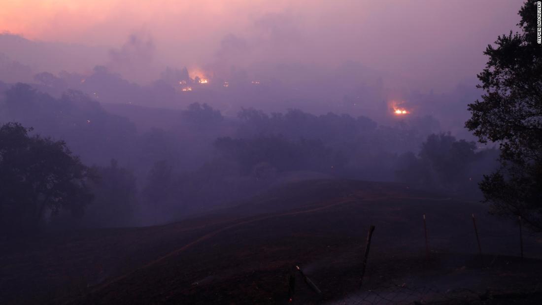 The sun rises above a smoke-filled valley in Geyserville on October 24.