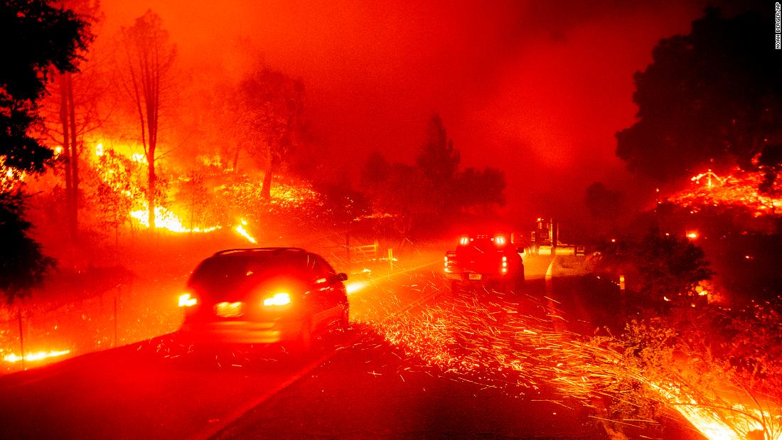 Embers fly across a roadway in Jimtown on October 24.