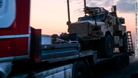 SHEIKHAN, IRAQ - OCTOBER 19: A convoy of U.S. armored military vehicles leave Syria on a road to Iraq on October 19, 2019 in Sheikhan, Iraq. Refugees fleeing the Turkish incursion into Syria arrived in Northern Iraq since the conflict began, with many saying they paid to be smuggled through the Syrian border. (Photo by Byron Smith/Getty Images)