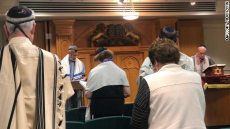 Joe Charny, right, leads a morning service ahead of the anniversary of the massacre at the Tree of Life synagogue.