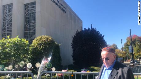 Judah Samet passes by the Tree of Life synagogue, which has been shuttered since the attack.